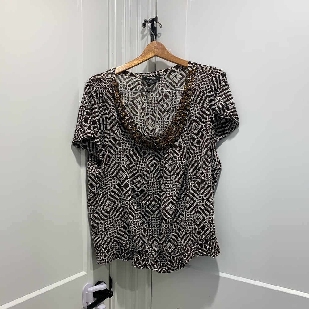 Summer top. Very comfortable. Wore very few times